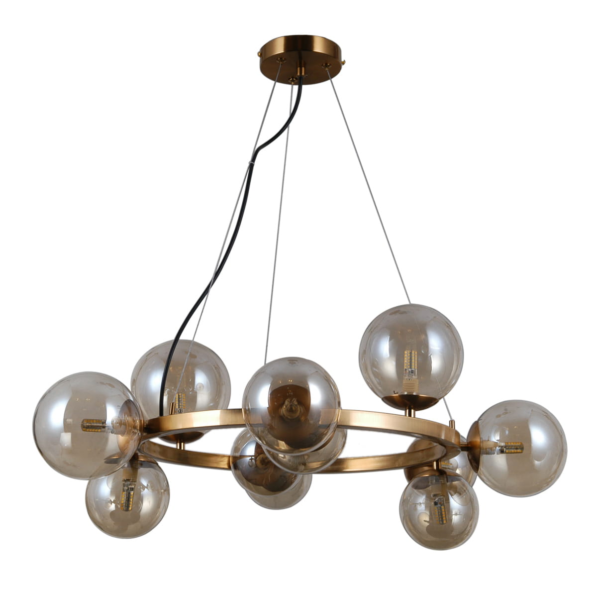 Lampa wisząca Montora 11-punktowa w kolorze mosiądzu. Okrągła konstrukcja z przezroczystymi kulami, zawieszona na cienkich linkach. Widoczne źródła światła w kulistych kloszach, elegancki design.